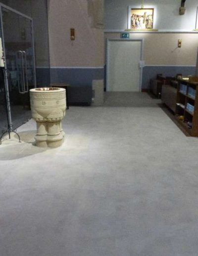 Clean and modern grey carpet installation in a church.